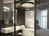 Hotelzimmer mit Bad und Schlafraum - Marmorfliesen und Deckenleuchte Lederam C150 von Catellani & Smith.